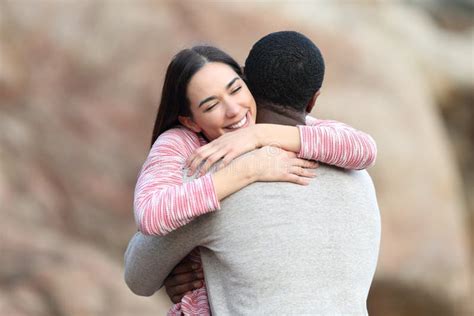 Happy Woman Hugging A Man Outdoors Stock Image Image Of Bliss