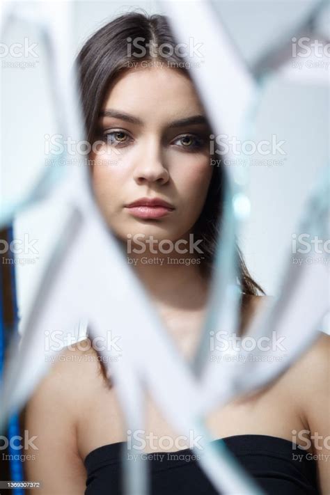 Young Woman Looks In A Broken Mirror Portrait Of Beautiful Female In