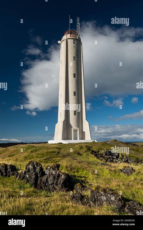 Close Up Of A Futuristic Icelandic Lighthouse Against A Blue Sky With