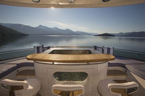 The Inside Of A Boat With Mountains In The Background