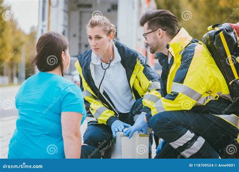 Emergency Medics Talking To Injured Woman Stock Photo Image Of Helper