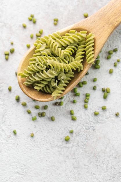 Premium Photo Mung Bean Fusilli Pasta On A Gray Concrete Background