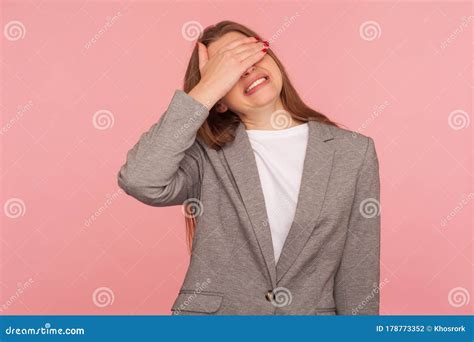 Don`t Want To Look Portrait Of Displeased Young Woman In Business Suit Covering Eyes With Hand