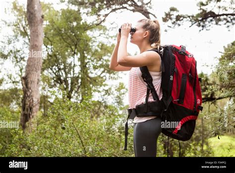 Blonde Hiker Looking Through Binoculars Stock Photo Alamy