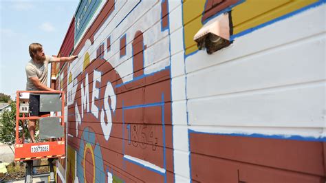 New downtown Ames mural highlights city, Iowa State Univeristy landmarks