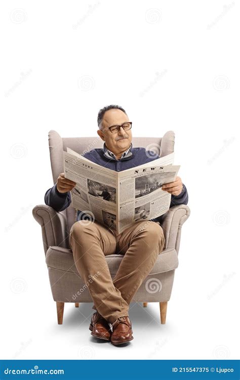 Mature Man Reading A Newspaper Seated In An Armchair Stock Image Image Of Paper Comfortable