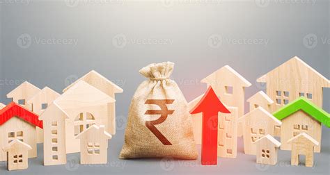 Indian rupee money bag and a city of house figures and red up arrow