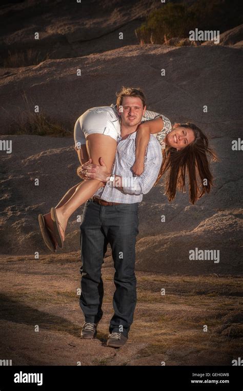 Guy Carrying Girl Over Shoulder