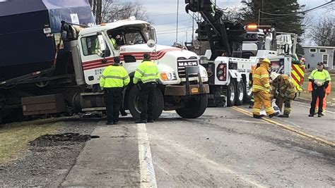 Garbage truck driver hurt in crash