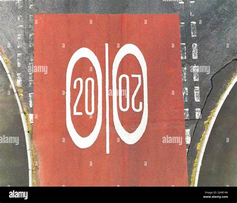 Overhead Aerial View Of Road Markings For A 20 Mph Speed Limit In A