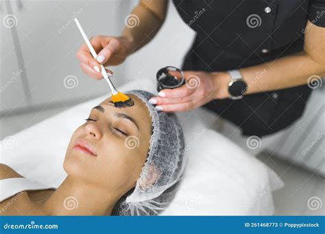 The Beginning Of Facial Procedure At Beauty Salon Indoor Portrait Of A Pretty Young Latin Girl