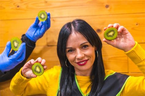 Premium Photo Portrait With Many Kiwis In The Hand Of A Brunette