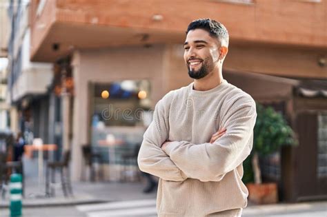 Young Arab Man Smiling Confident Standing With Arms Crossed Gesture At