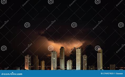 Electric Storm Over City Skyscrapers In The Dark Night Sky Stock Image