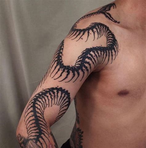 Snake Skeleton Tattoo In 2023 Skeleton Tattoos Skull Hand Tattoo