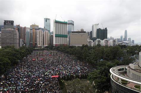 Hong Kong Protesters Defy Threats From Beijing Police And Heavy Rain