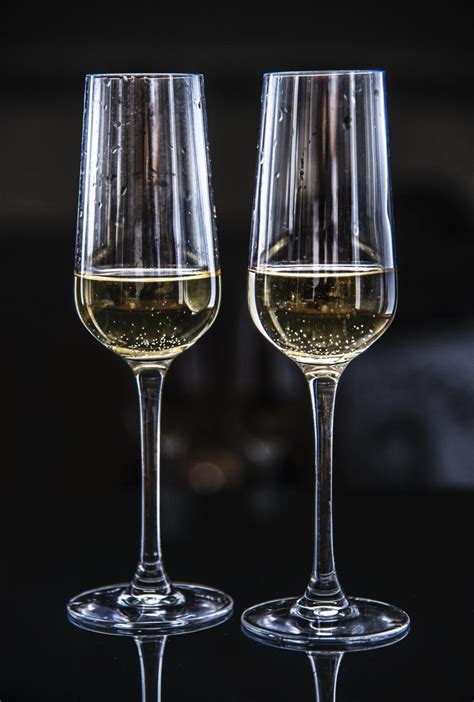 Free Stock Photo Of Close Up Of Two Partially Filled Champagne Glasses