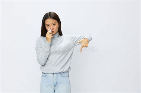 Asian Woman Holding Hand With Handkerchief And Coughing Up Flu And Cold