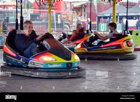 People enjoying bumper cars also known as bumping cars, dashing cars Stock Photo: 73119806 - Alamy