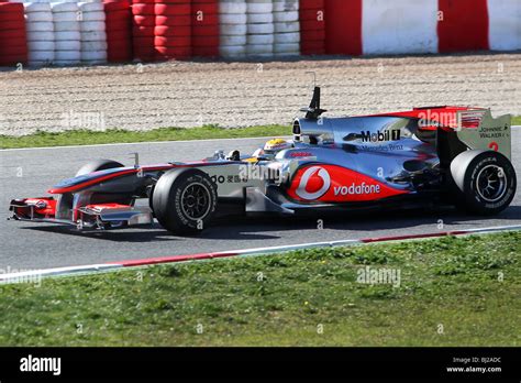 Lewis Hamilton Driving The 2010 Mclaren Mercedes Formula One Car In