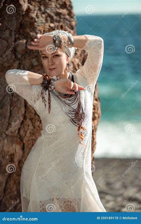 Middle Aged Woman Looks Good with Blond Hair, Boho Style in White Long
