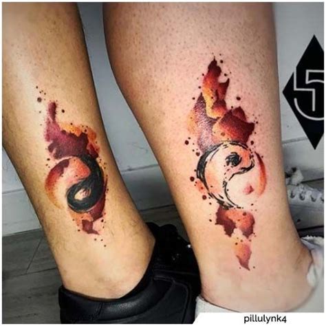 Two People With Matching Tattoos On Their Legs