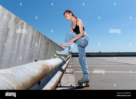 Girl Tying Up Her Roller Skates Urban Background Preperation For