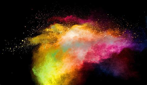 Multicolored Powder Explosion On Black Background Colorful Red Yellow