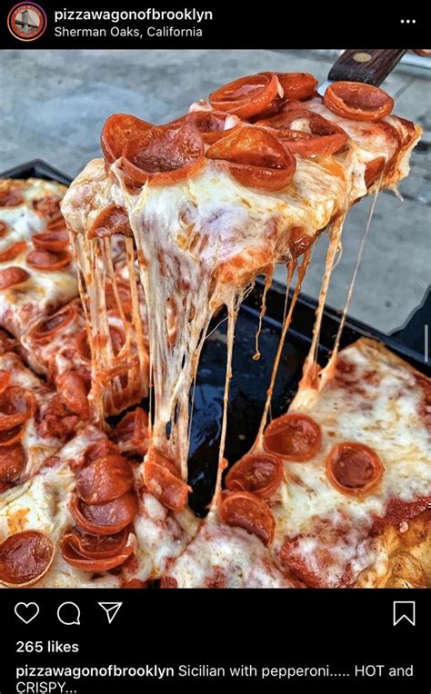 A Slice Of Pepperoni Pizza Being Lifted From A Pan