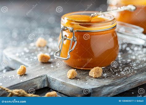 Salted Caramel And A Spoon In A Glass Jar Stock Image Image Of Sauce