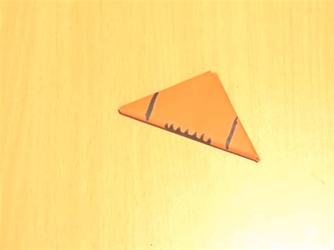 how to make a paper football 3