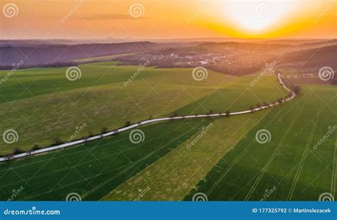 Aerial View Of Agriculture Land During Beautiful Sunset Fields And