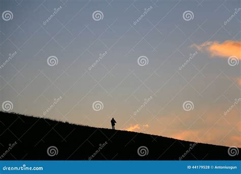 Silhouette of a Man Walking Away in Sunset Stock Photo - Image of ...