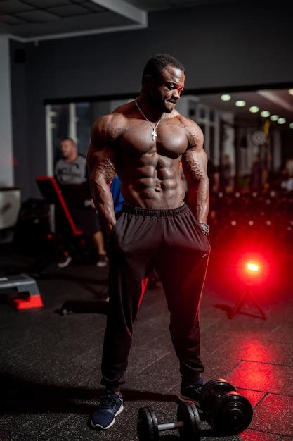 Premium Photo Handsome Strong Man With Naked Torso Athletic Model Guy Showing His Muscles