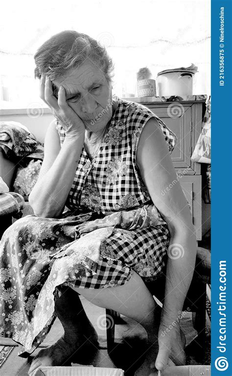 Upset Senior Woman Holds Her Head With Hand Black And White Conceptual