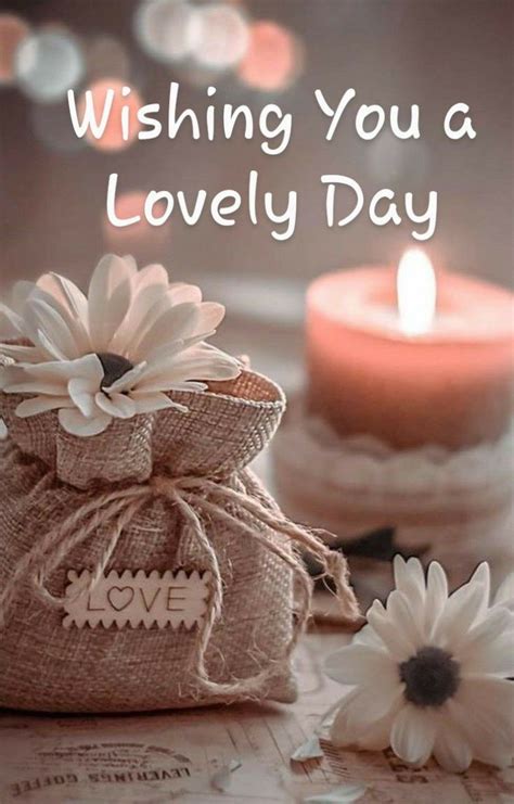 A Small Bag Sitting On Top Of A Table Next To A Candle And Some Flowers