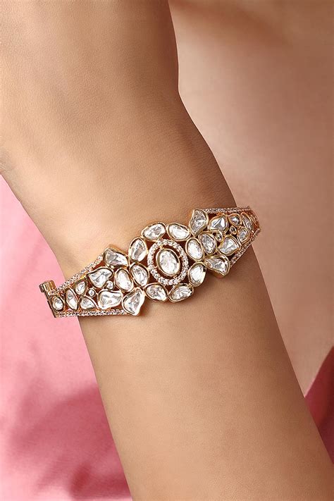 Buy Gold Plated Kundan Polki Embellished Floral Cutwork Bracelet By