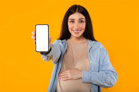 Pregnancy Advertisement Excited Pregnant Woman Pointing Aside At Copy