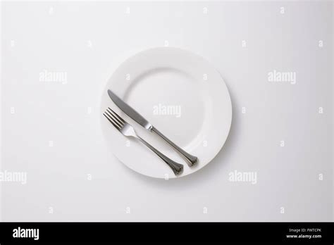 Empty Plate And Cutlery Stock Photo Alamy