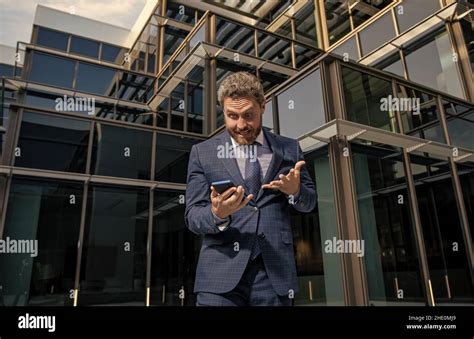 Shocked Businessman Look At Smartphone Man Boss Has Conversation