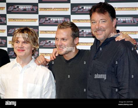 U S Director Frakes Poses With U S Actors Corbet And British Actor