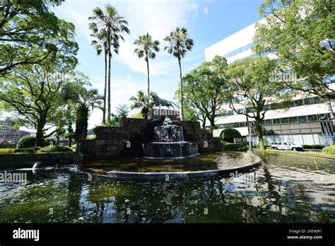 A Water Fountain With A Bronze Sculputre Of A Lion In Lyons Park In