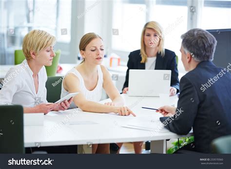 Negotiation In Business Team Meeting In The Office Stock Photo