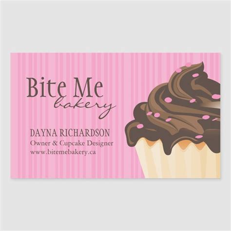A Business Card With A Chocolate Cupcake On The Front And Pink Stripes