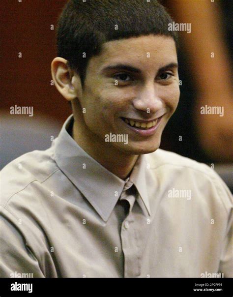 Defendant Michael Salas Smiles At One Of His Defense Lawyers Prior To