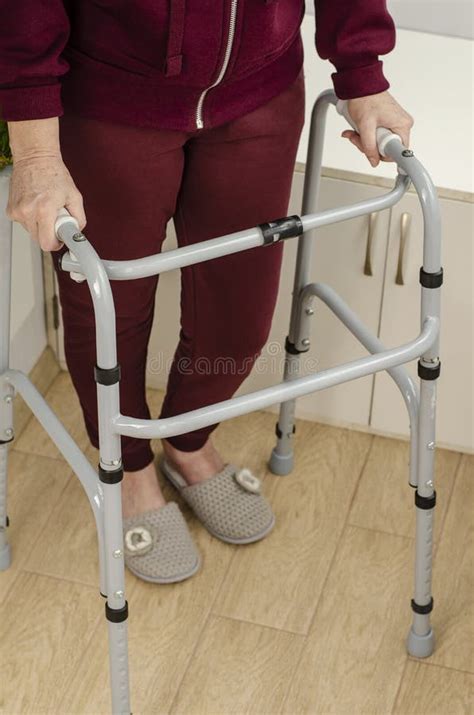 Hands Of A Senior Woman On The Handles Of A Walker Stock Photo Image