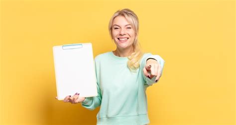 Premium Photo Blonde Woman Pointing At Camera With A Satisfied