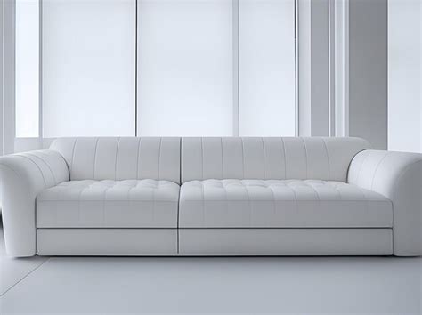 Premium AI Image | A white couch in a room with a large window behind it.