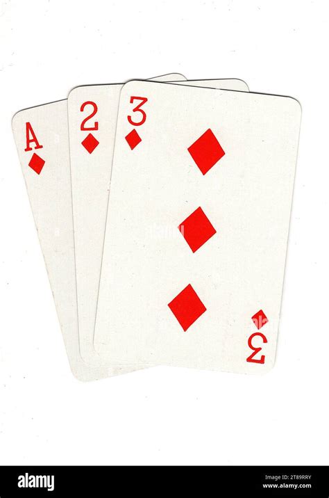 Antique playing cards showing a three card run of ace, two and three of diamonds on a white ...