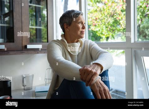 Mature Woman Alone At Home Stock Photo Alamy